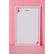 Cherry Blossom Notepad by Pinkie Skies Studio featuring a delicate floral design on a vibrant pink background.