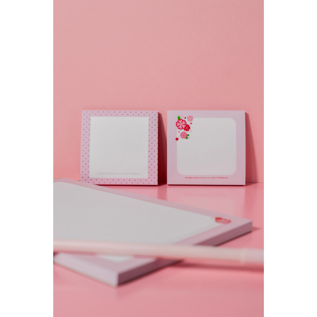 Product photography of Pinkie Skies Studio pink stationery set on a pink background