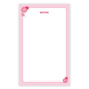 Cherry Blossom Notepad from Pinkie Skies Studio featuring a floral design on a white background.